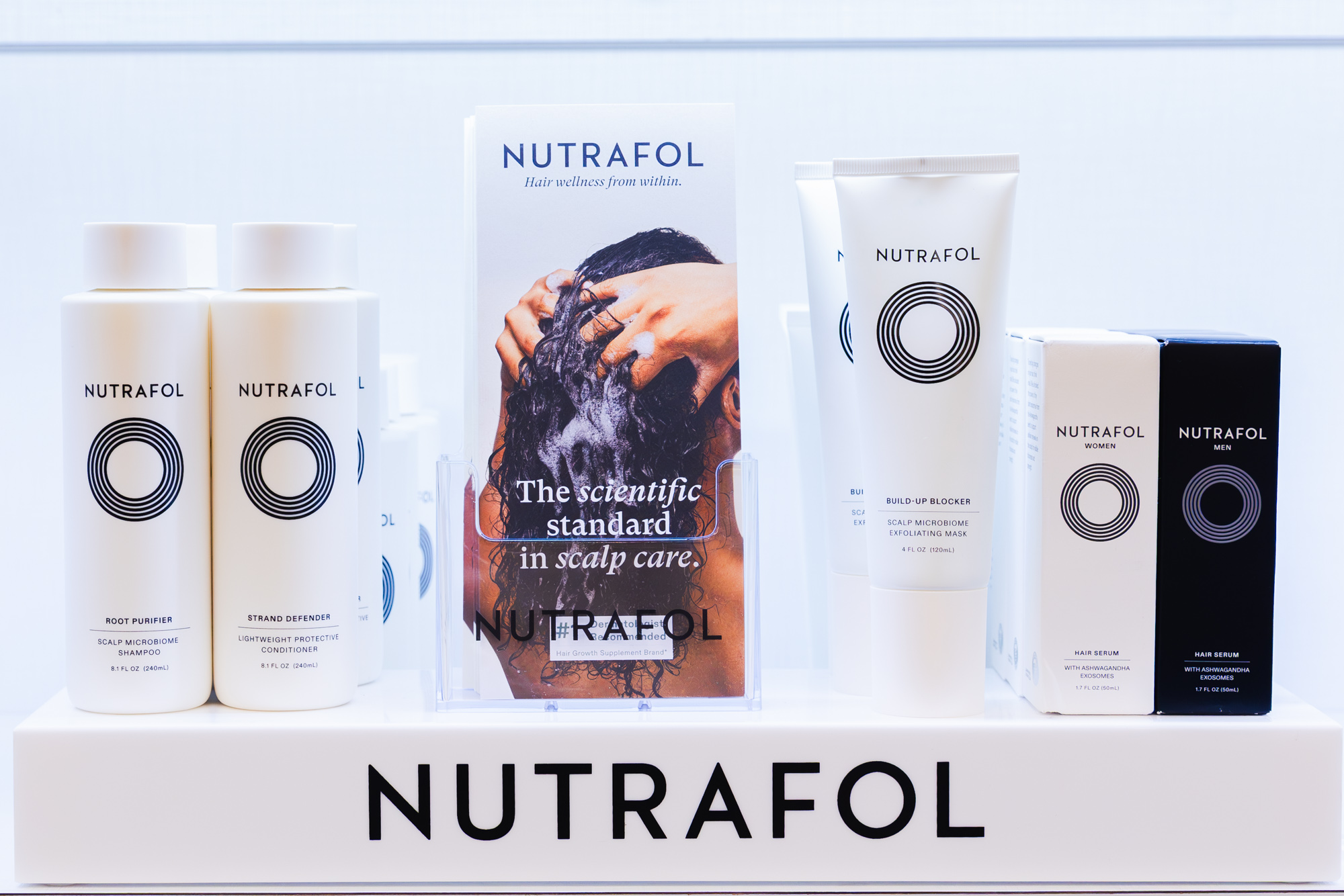 Hair restoration products called Nutrafol neatly placed on display because they are sold by a hair dermatologist in Plano.