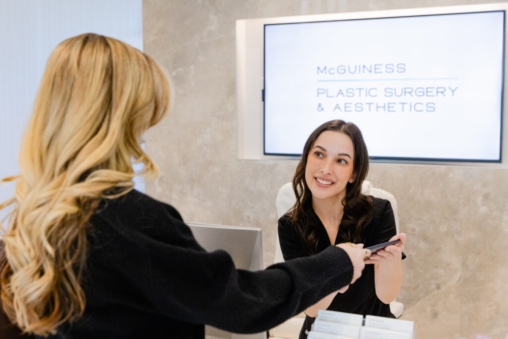A patient checks in before her appointment for coolsculpting in Plano at McGuiness.